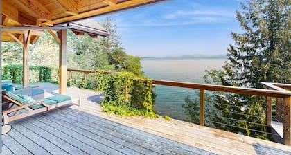 Beautiful lakefront lodge w/ views, private beach access, & large deck