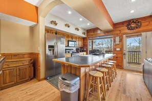 Microwave, dishwasher, spices, dining tables