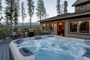 Enjoy the private hot tub all year round