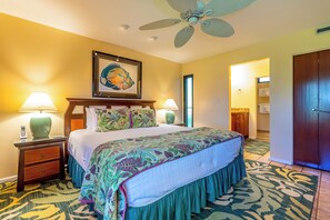 A hotel room with a large bed, two bedside lamps, a ceiling fan, and a framed artwork above the bed. - Fabulous Ulua Beach & Lush Grounds Await: Wailea Elua 807, Ground floor Gem! (Wailea)
