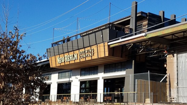 A building with a sign reading "New Realm Brewing Company" on the side. - In heart of Atlanta, short walk to museums & restaurants FREE off street parking (Atlanta)