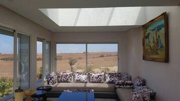 Villa | Living room | Flat-screen TV, fireplace, ping pong