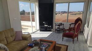 Villa | Living area | Flat-screen TV, fireplace, ping pong - Villa Salma (Sahel Oulad H'Riz)
