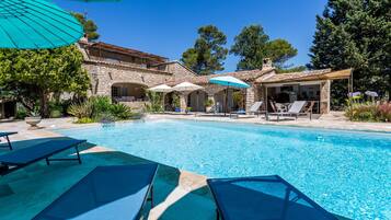 Seasonal outdoor pool, open 9 AM to 6 PM, pool umbrellas, pool loungers