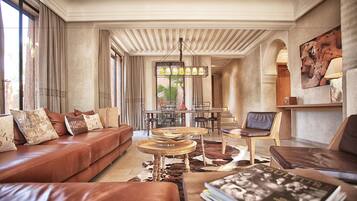 Family Villa, 4 Bedrooms | Living area | Flat-screen TV, fireplace