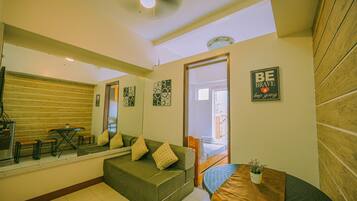Deluxe Condo, 1 Double Bed, Mountain View | Living area | Flat-screen TV