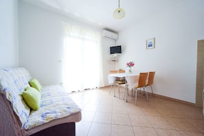 Apartment, 1 Bedroom, Terrace | Living area | Flat-screen TV