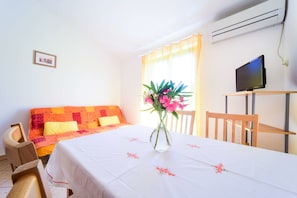 Apartment, 1 Bedroom, Terrace, Sea View | Living room | Flat-screen TV