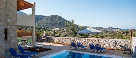 Outdoor pool, pool umbrellas, pool loungers