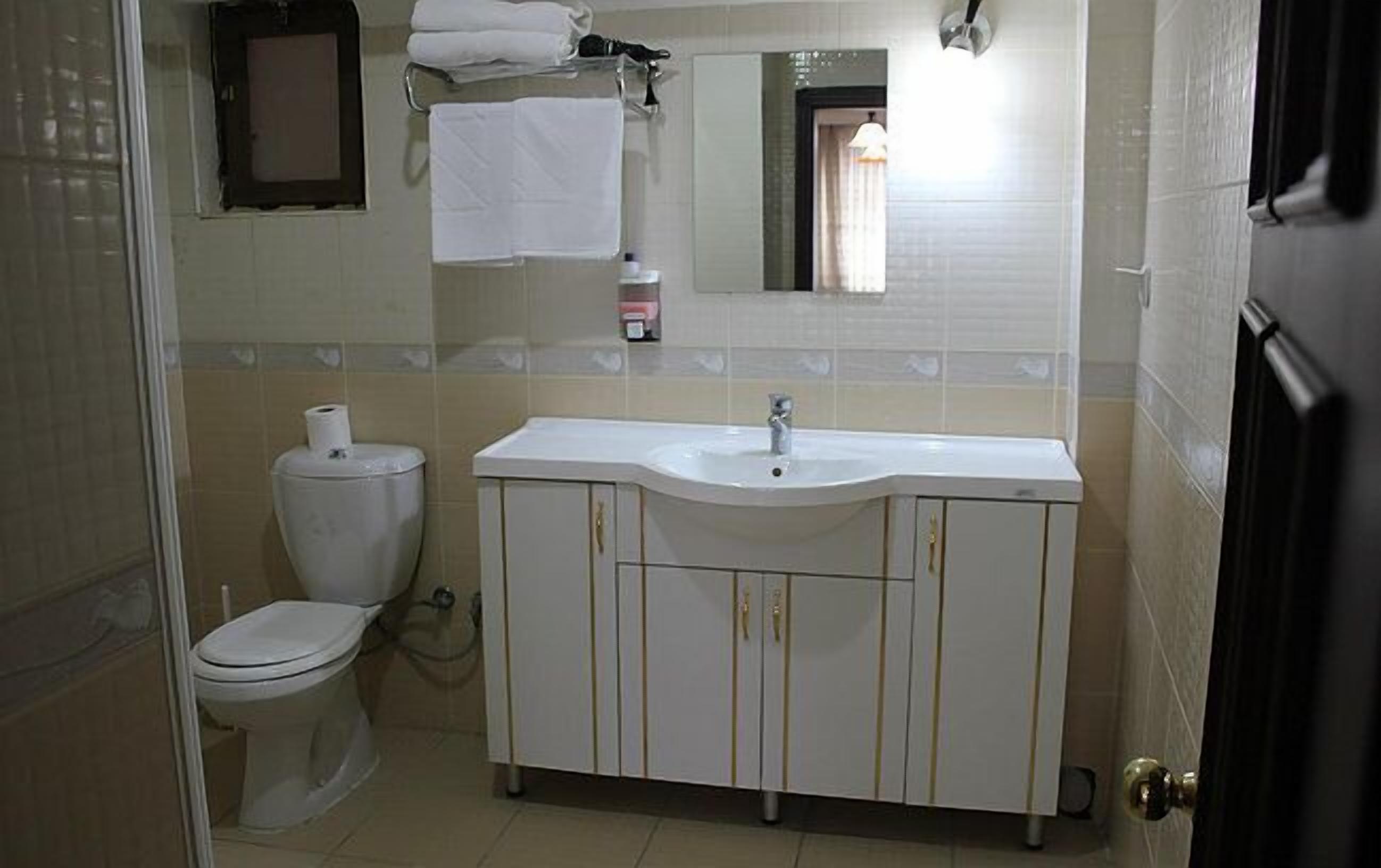 standard quadruple room | bathroom | shower, free toiletries, hair dryer, slippers