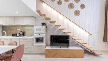 Executive Apartment | Living area | 103-inch LED TV with digital channels, TV