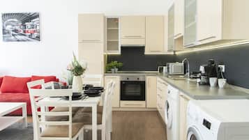 Deluxe Apartment | Living area | TV