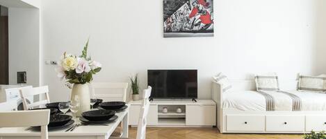 Deluxe Apartment | Living area | TV