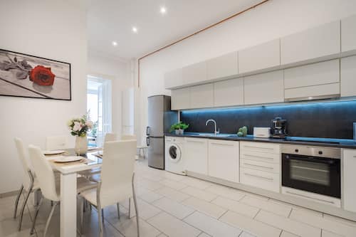 Executive Apartment | Private kitchen | Fridge, high chair, dining tables