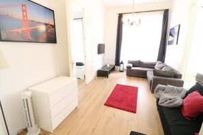 Appartement Exclusif | Coin séjour | Télévision