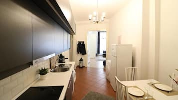 Exclusive Apartment | Private kitchen | Fridge, high chair, dining tables