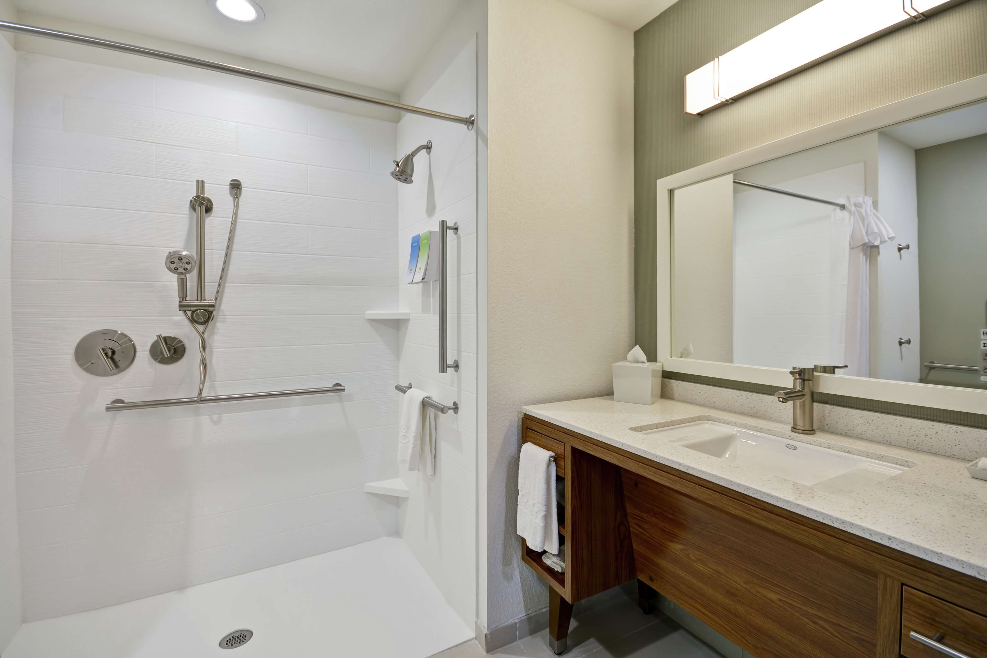 studio, 1 king bed, accessible (mobility & hearing, roll-in shower) | bathroom | hair dryer, towels