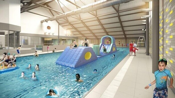 An indoor swimming pool with slides and play structures. - Bianca's House Hotel Heathrow Airport (Slough)