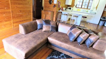 Deluxe Chalet, Garden View | Living room | 40-inch flat-screen TV with satellite channels, TV