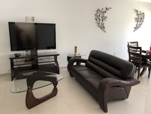 Casa | Sala d'estar | Televisor de pantalla plana i pel·lícules de pagament 