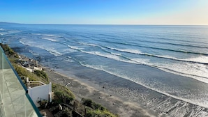 A coastal view with a beach, ocean waves, and a clear sky. - Bluff-Top Beauty With Ocean Views - 1086 (Encinitas)