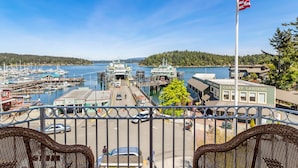 A harbor with boats, a cannery landing building, and a flag. - San Juan Island, Yakima Suite #1901 (Friday Harbor)