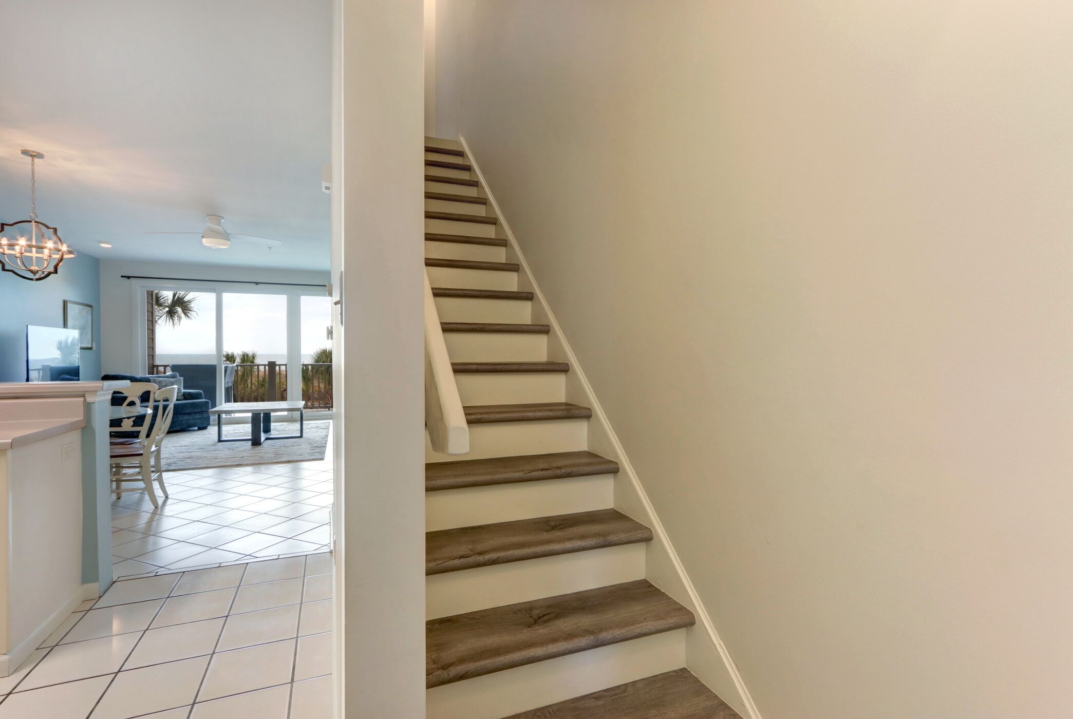 A staircase with wooden steps leading to a second floor.
