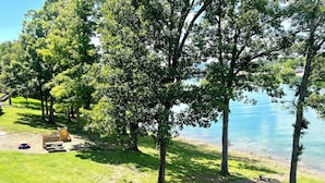 A lakeside park with picnic tables and a playground. - 3 BR, 2 Bath Condo at Vickery Resort &  Table Rock Lake with Dock Access (Hollister)