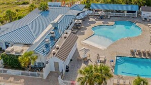 A resort with a large pool, beach access, and a view of the ocean. - Summer & July 4th Savings at Beachside Colony Tybee's ONLY Oceanfront Resort 3/2 (Tybee Island)