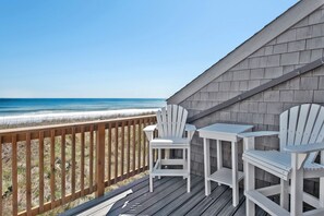 A wooden deck with a view of the beach and ocean. - Whispering Sands #7: Oceanfront, Shared pool (Nags Head)