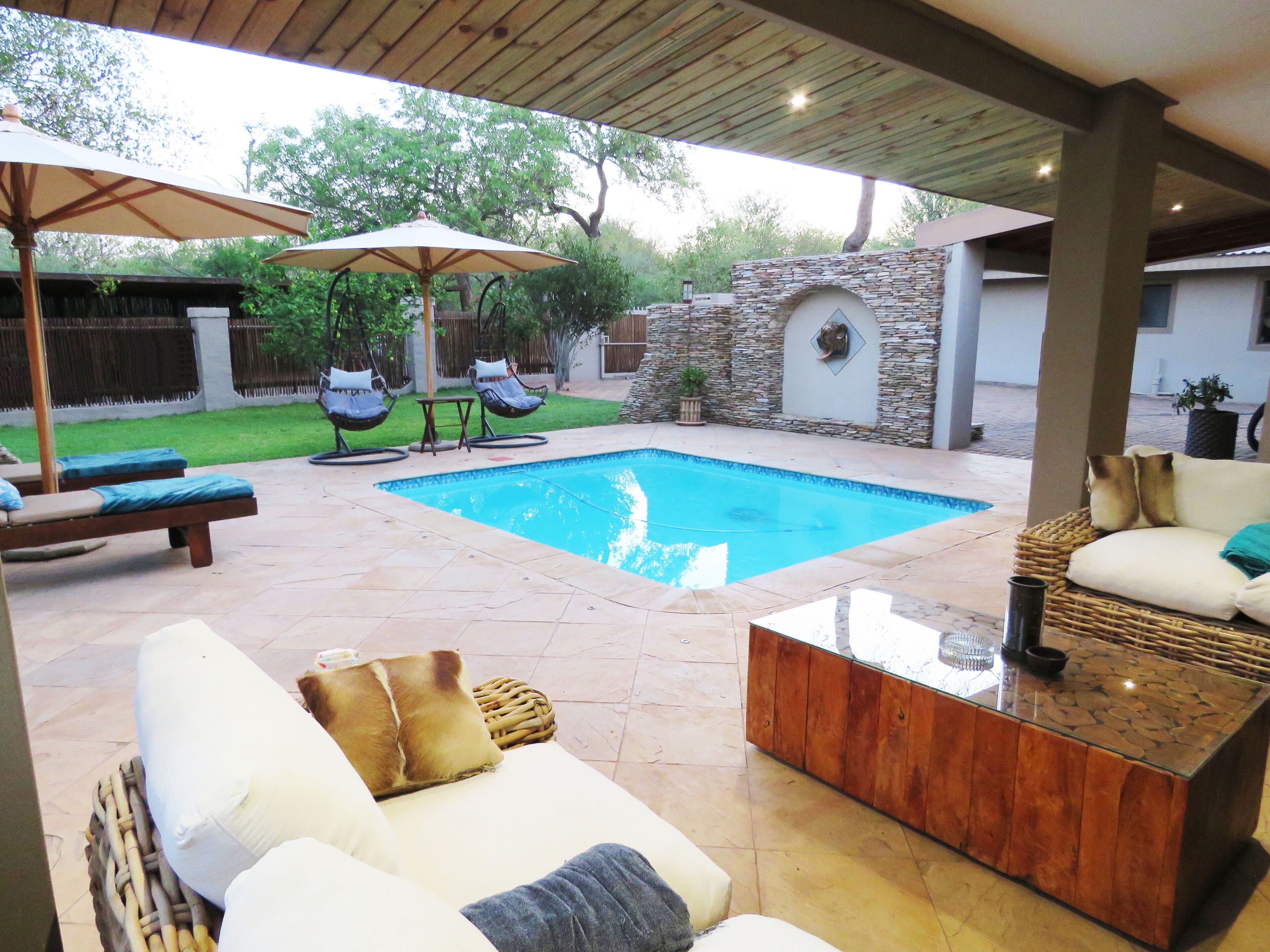 Outdoor pool, open 7:00 AM to 8:00 PM, pool umbrellas, pool loungers