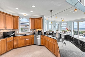 Granite counters and plenty of prep space make group meals easy, with Gulf views as a bonus.