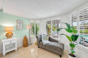Claim this sunny corner for a good book or a quiet moment between Siesta Key adventures. - La Contento Casa | Private Heated Pool, Pet Friendly, Walk to Siesta Key Village and Beach (Siesta Key)