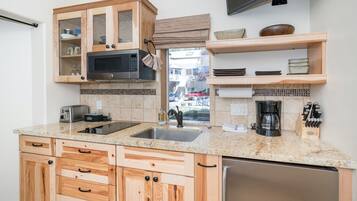 Microwave, stovetop, coffee/tea maker, toaster
