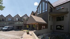 A modern building with a covered entrance labeled "Viking Lodge." - Cozy Viking Lodge 105: One-bedroom escape with hot tub access (Telluride)
