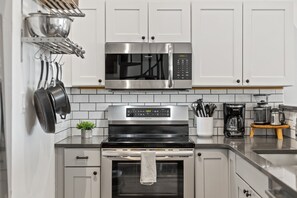 Coffee/tea maker, fridge, microwave, oven