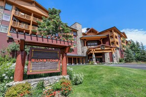 Enter a serene oasis with a beautifully maintained lawn and lush greenery.