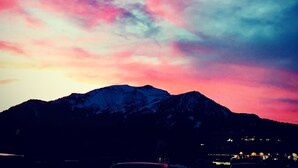 A mountain range at dusk with a colorful sky. - Mountainback #49, Den (Mammoth Lakes)