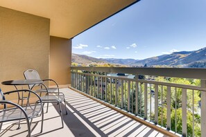 Enjoy breathtaking views of the surrounding mountains from this balcony.