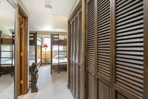 Experience a traditional hotel room with a comfortable bed, wooden furniture, and a cozy atmosphere.