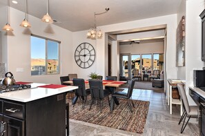 Enjoy a spacious open-plan living area with a kitchen, dining space, and comfortable seating.
