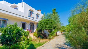 A white building with a sloped roof, a satellite dish, and a small balcony. - VILLA GARBA - Villa with private pool in Felanitx. Free WIFI (Felanitx)