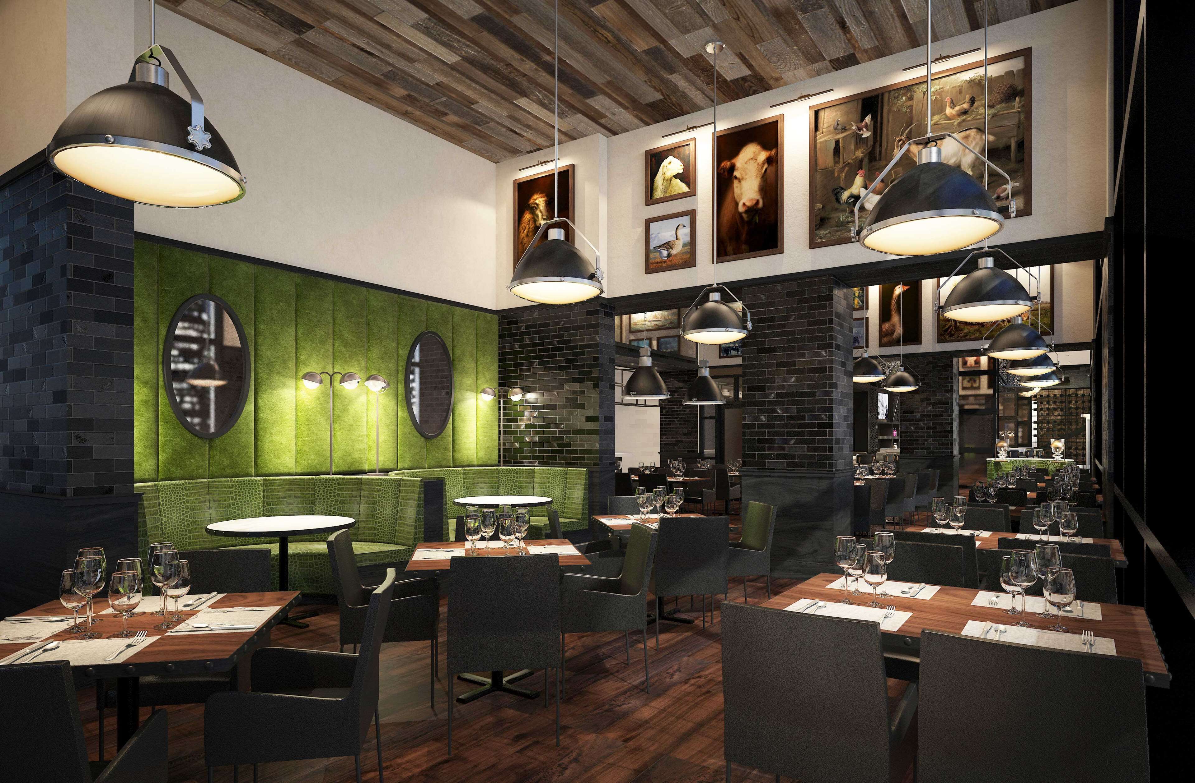 Een restaurant interieur met bakstenen muren, groene lambrisering en meerdere eettafels met stoelen.