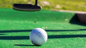Golfers can tee off in a serene natural setting.