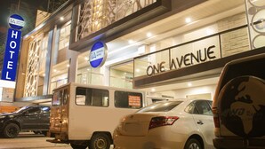 A hotel exterior with a sign for 'Express Hotel' and 'One Avenue'. - 1A Express Hotel (Cagayan de Oro)