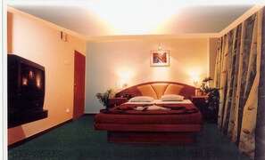 Executive Suite, Garden Area | In-room safe, desk, rollaway beds, free WiFi