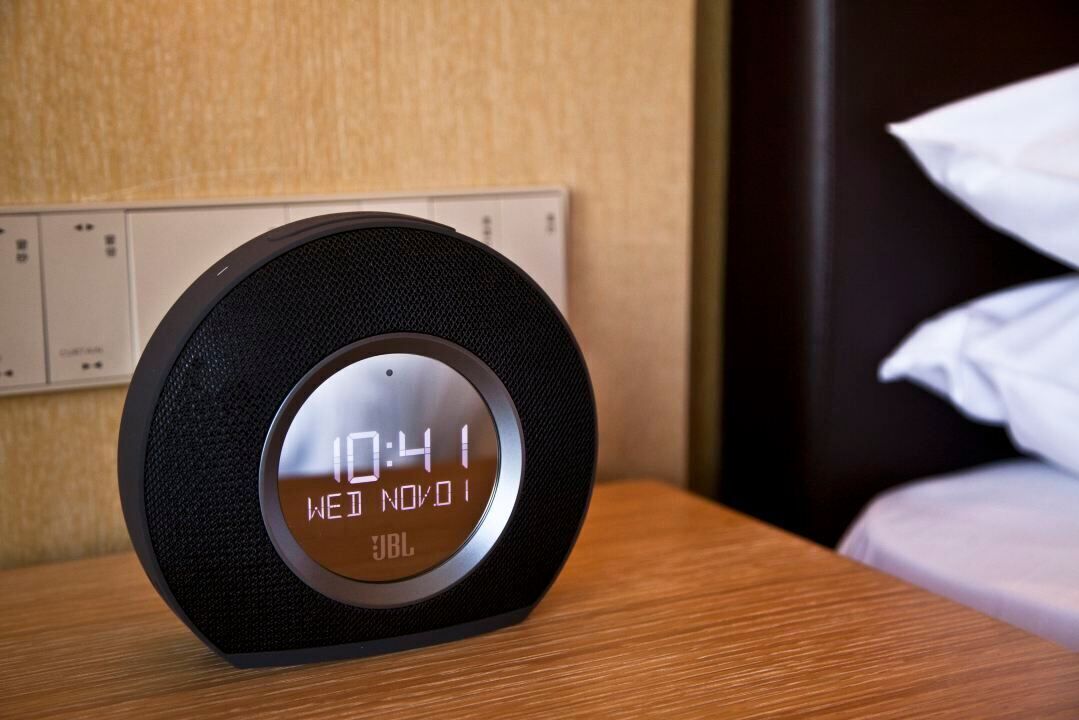 A digital clock with a black frame and a metallic face displaying the time as 10:41.