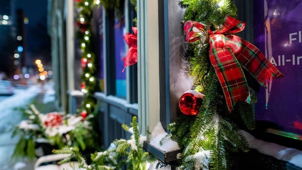 A building facade with windows decorated with Christmas wreaths and lights. - Granville Hall Residence (Halifax)