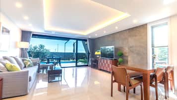 Big Family Suite Poolvilla, Ocean View | Living area | Heated floors