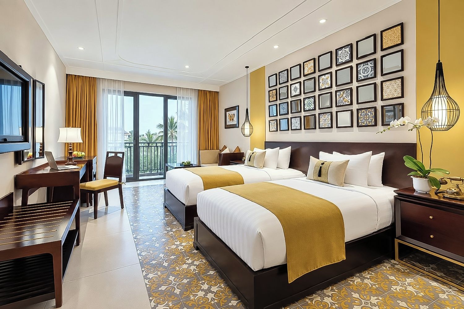 A hotel room with two beds, a desk, a chair, a TV, and a balcony with curtains.